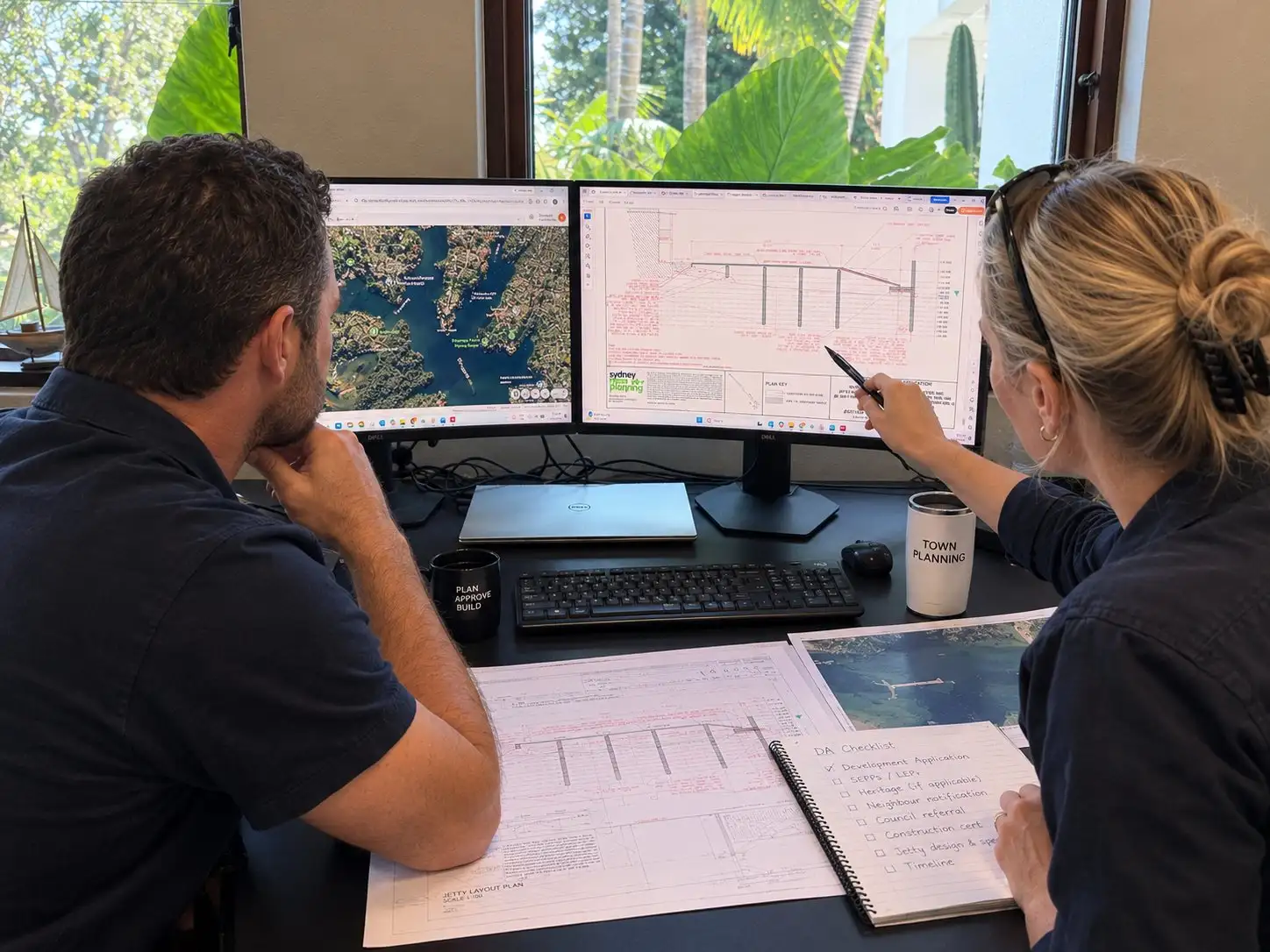 A planner and a Kingtide Marine project lead going through a jetty layout plan and a DA checklist on screen
