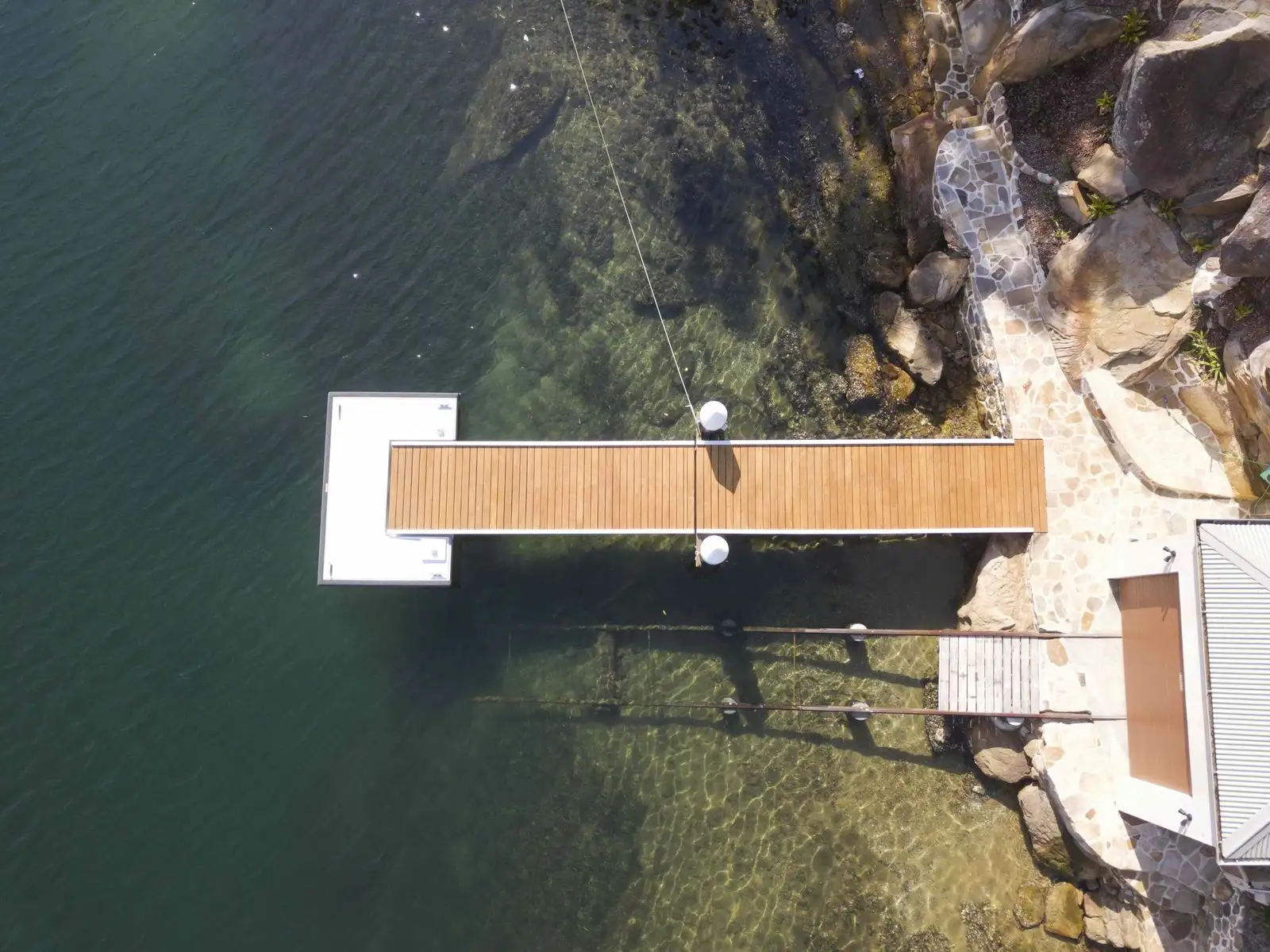 Aerial view of a Kingtide Marine jetty and pontoon on a Port Hacking River waterfront