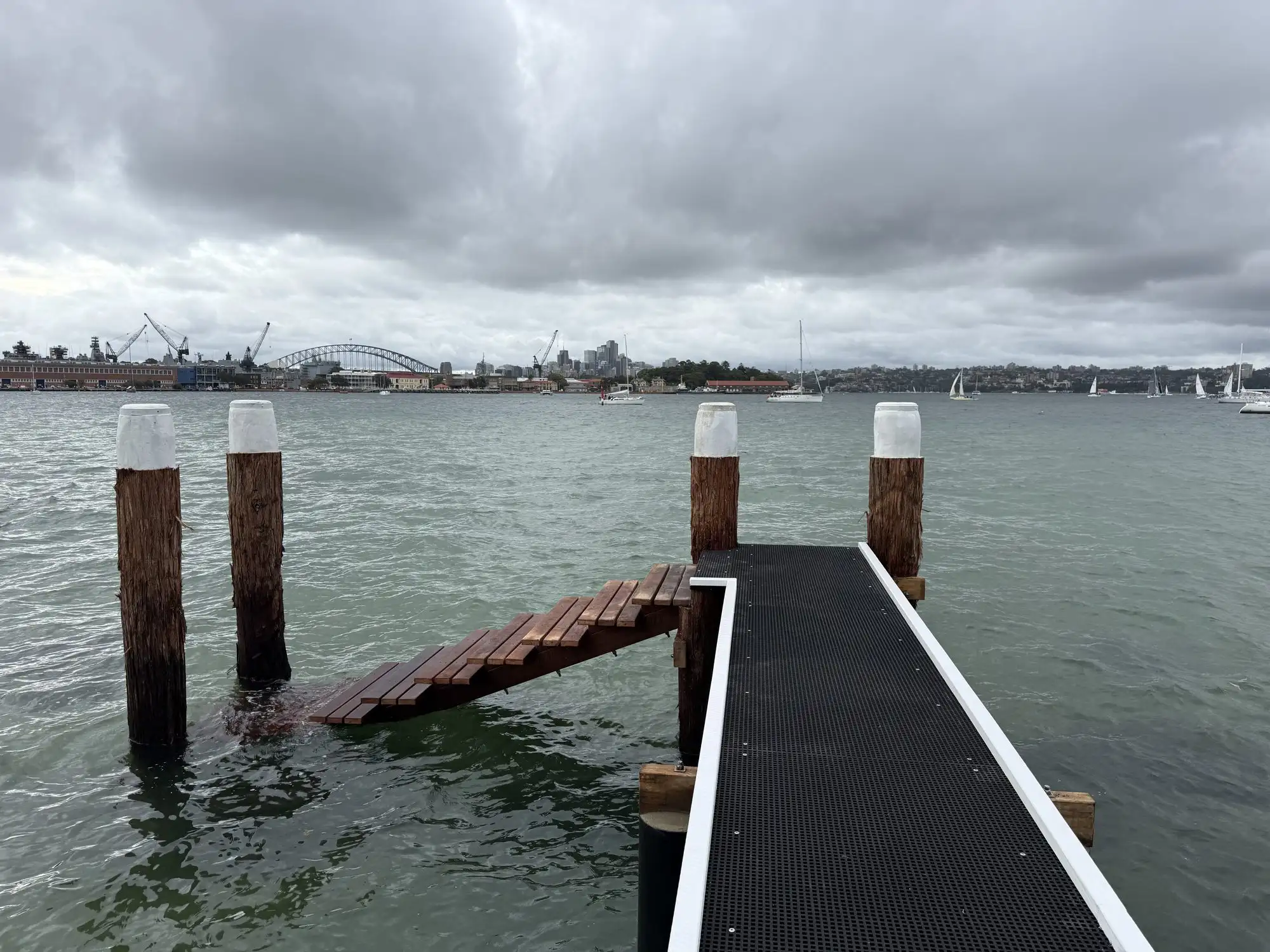 Marine piles being driven from a floating barge