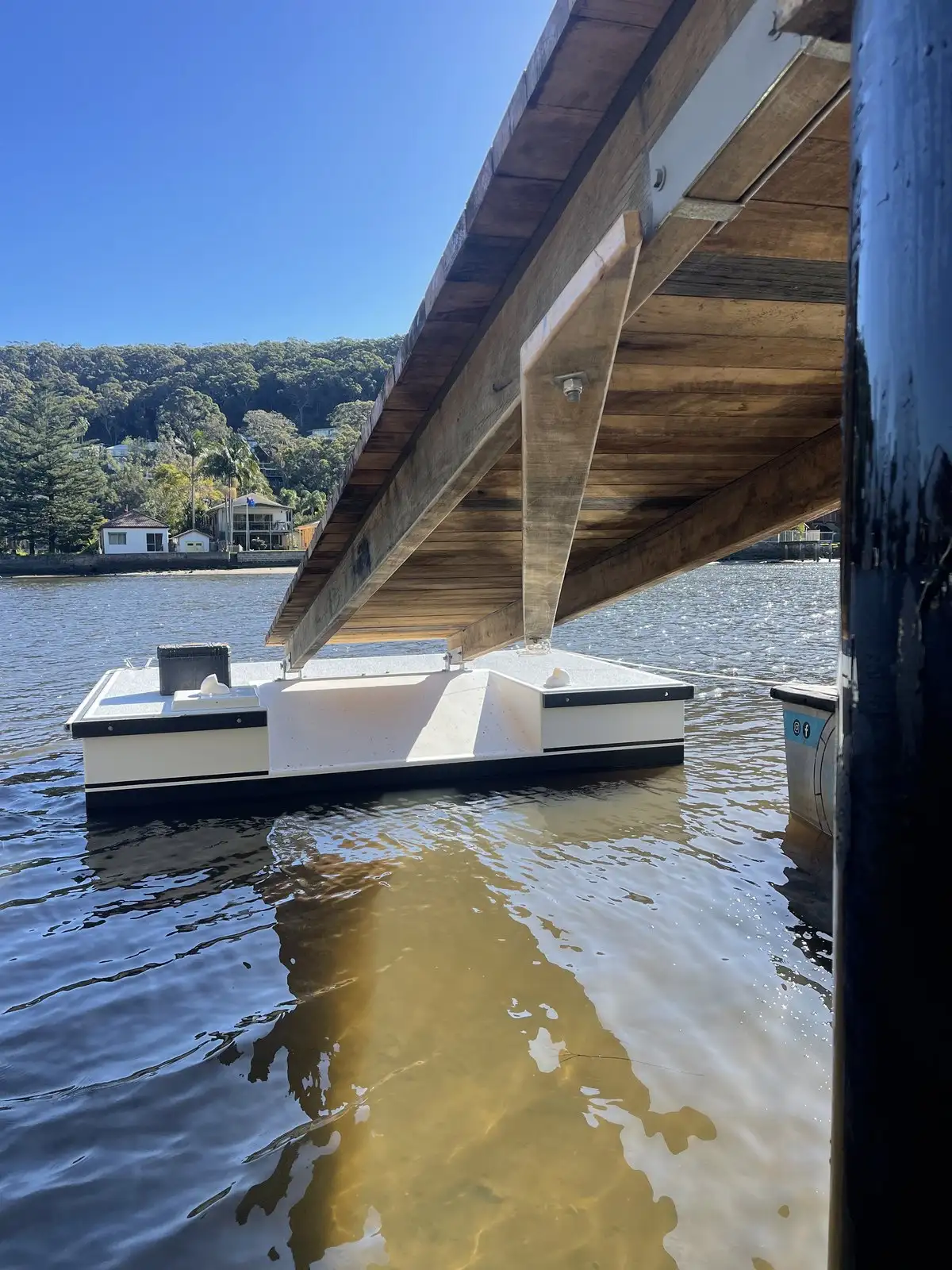 Pontoon and gangway seen from beneath the jetty it hinges from