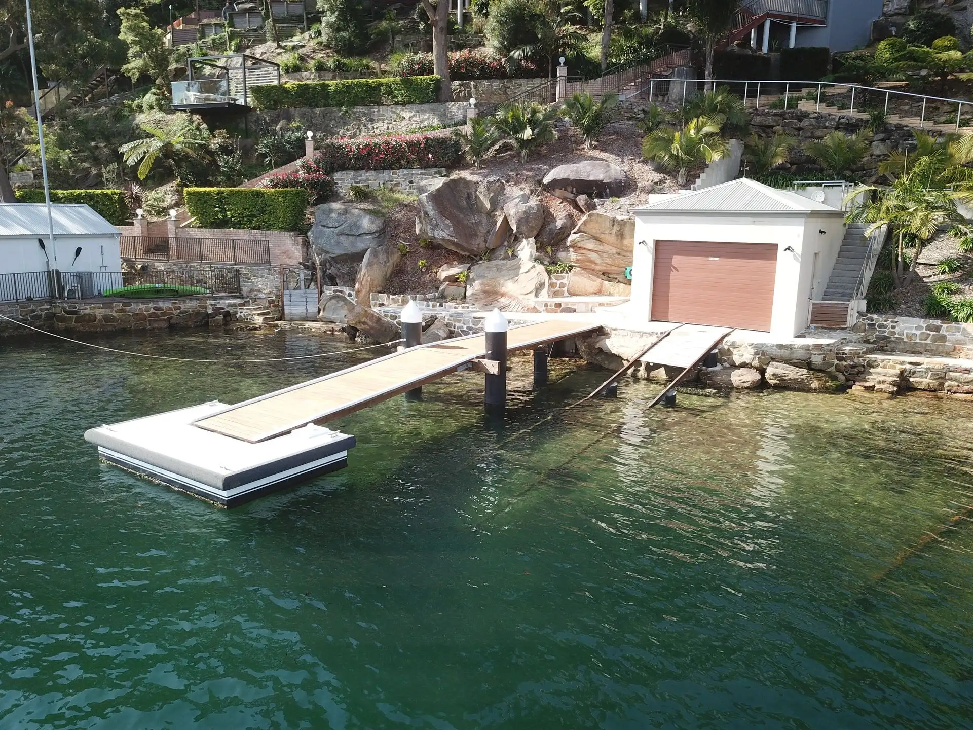 Aerial view of a Kingtide Marine jetty, floating dock and boathouse project on Port Hacking River
