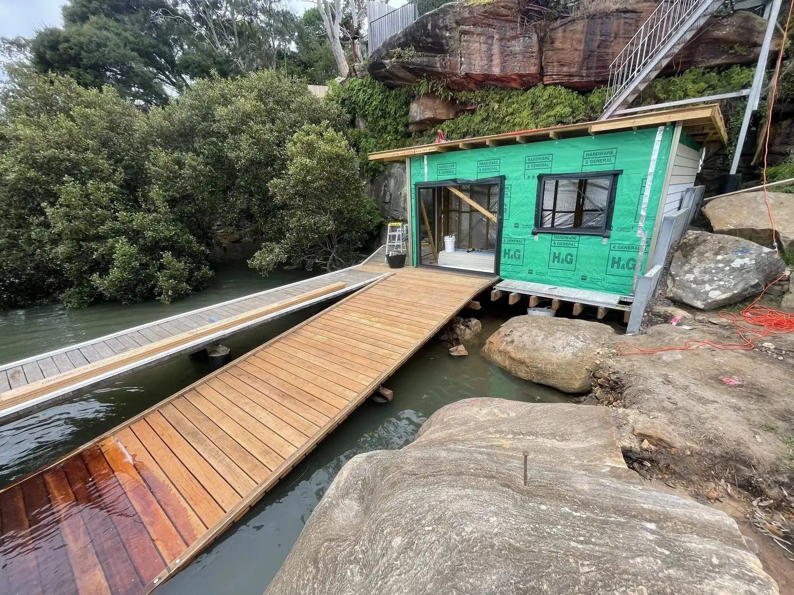 Skid ramp running from a lawn down to the water