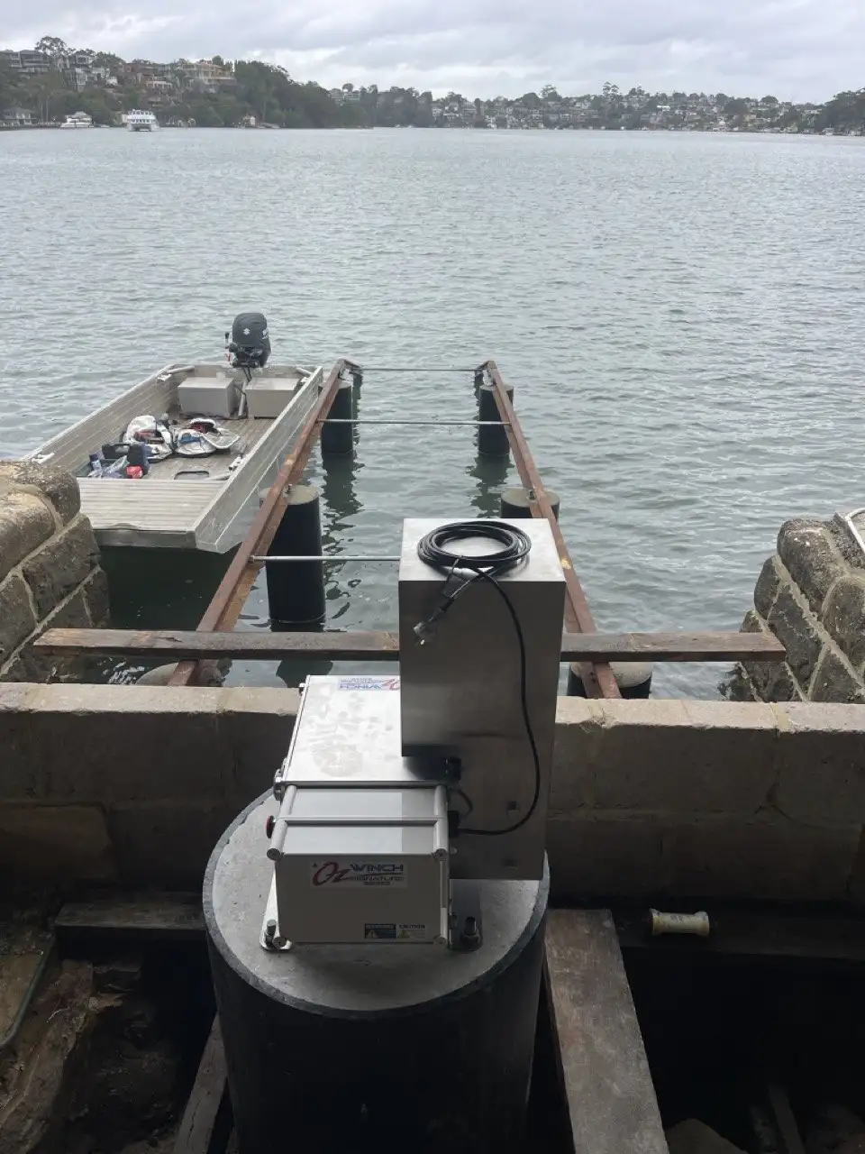 Winch and drive gear at the head of a slipway