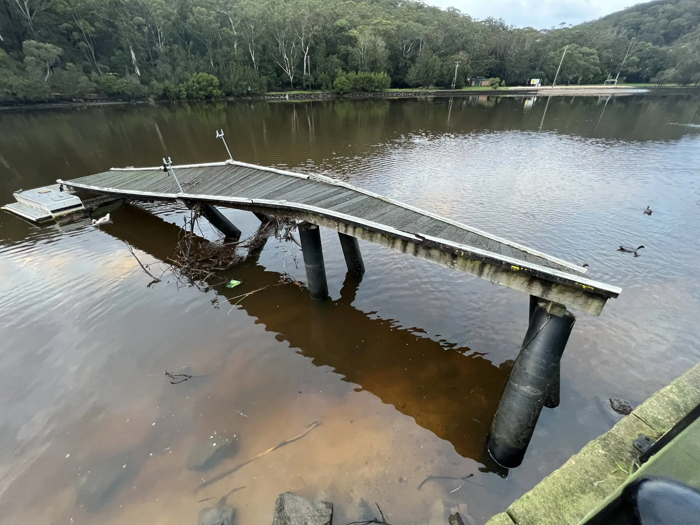 Floating pontoon on a Sydney waterway at first light after weather moved through