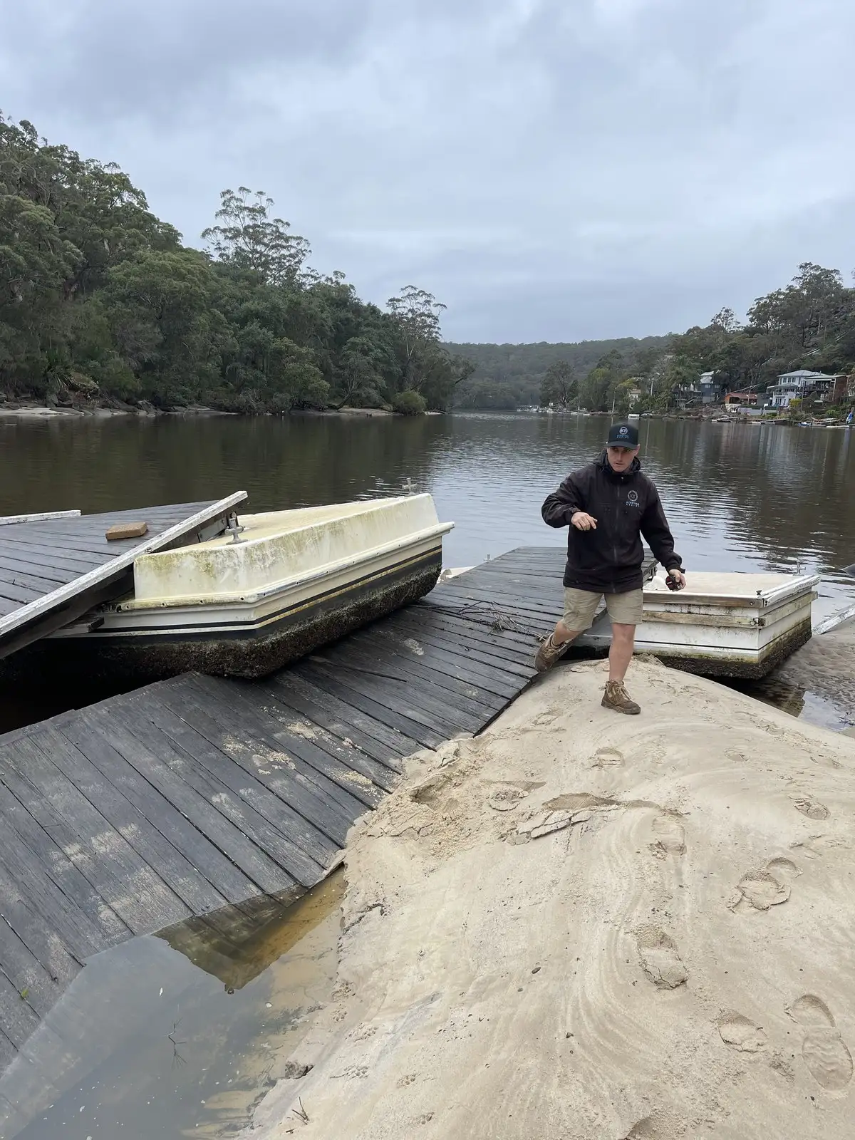 A pontoon torn from its piles and pushed up onto the foreshore