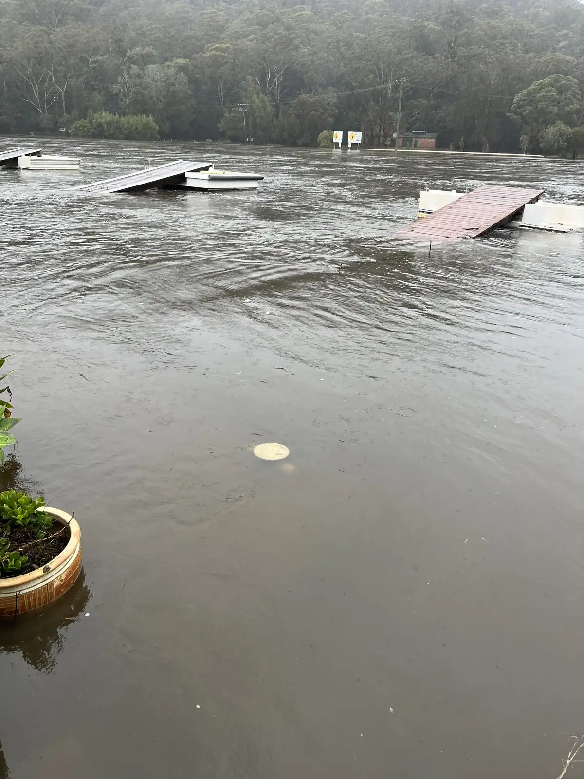 A pontoon and jetty almost entirely under flood water